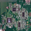 pexels-photo-343457-343457 Detailed image of a green circuit board featuring various components and microprocessors.